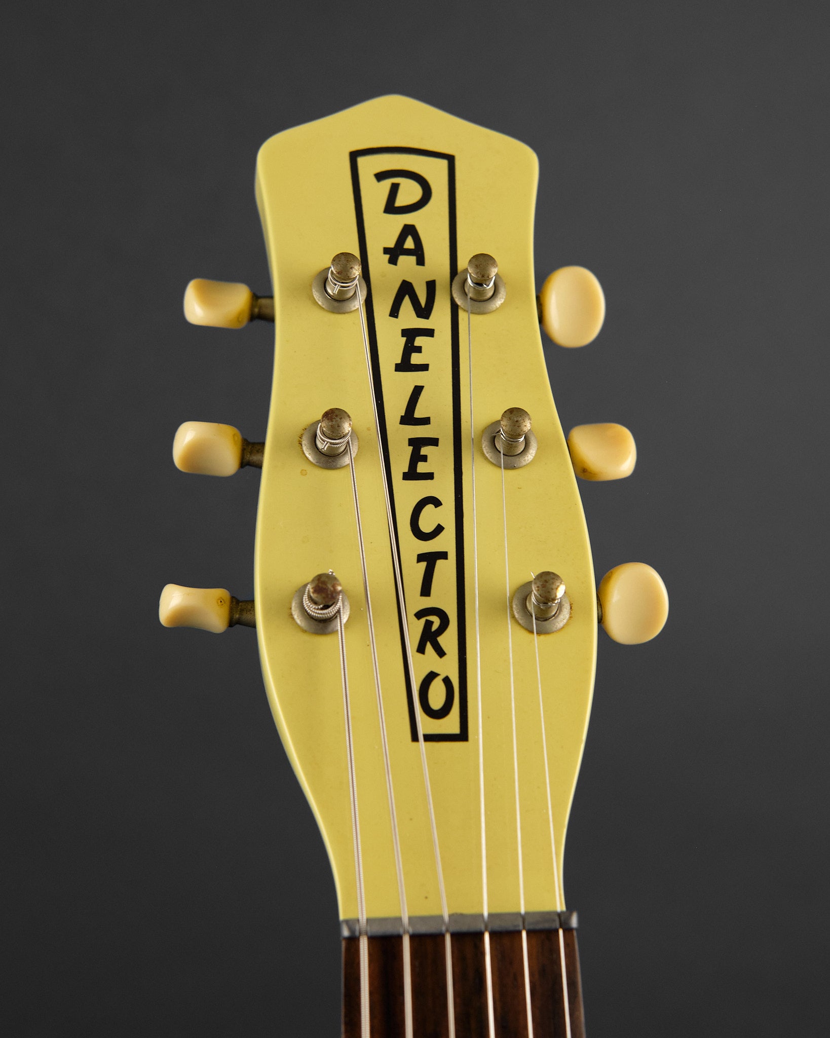 1990s Danelectro DC-59 Daddy-O Yellow - headstock front | Replay Guitars